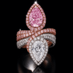 Twin pear diamond ring with pink and white diamonds, halo design luxury ring from Reeva Rare Twin pear diamond ring with pink and white diamonds, halo design luxury ring from Reeva Rare